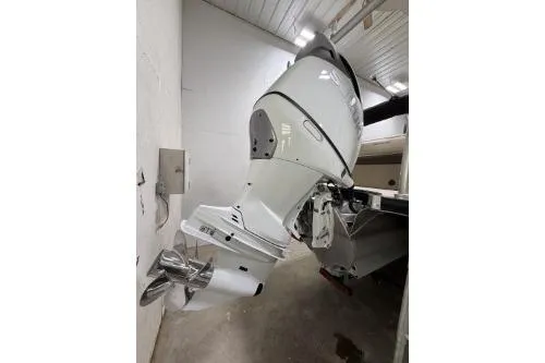 Slide: The Image of 2025 Berkshire 23ULESTS3-93 boat engine in a garage setting. - 24