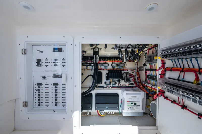 Slide: The Image of Electrical control panel of 2024 SeaVee 322z boat, showcasing wiring and circuit systems. - 13