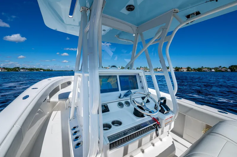 Slide: The Image of 2024 SeaVee 322z boat interior with modern dashboard on a sunny day. - 15