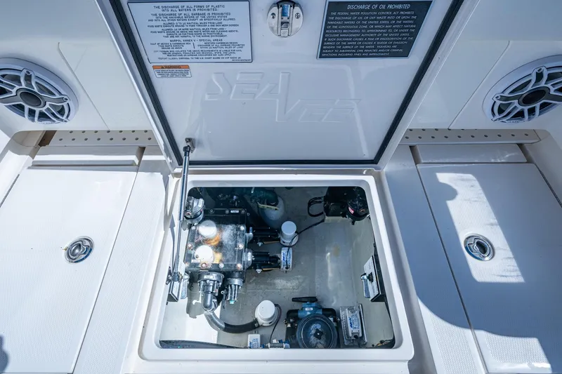 Slide: The Image of 2024 SeaVee 322z boat compartment with mechanical components and speakers. - 21