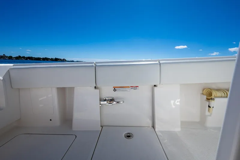 Slide: The Image of 2024 SeaVee 322z boat deck with clear blue sky and ocean view. - 23