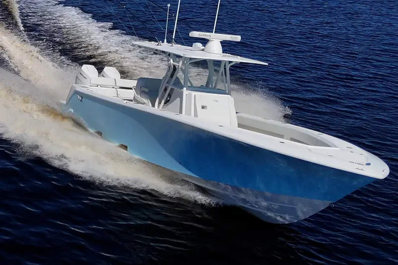 Slide: The Image of 2024 SeaVee 322z boat cruising on open water, showcasing sleek design and performance. - 26