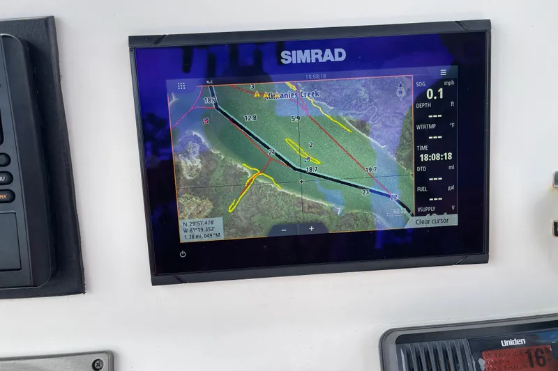 Slide: The Image of Garmin GPS navigation screen on 2014 ShearWater 23TE boat displaying a nautical map. - 13