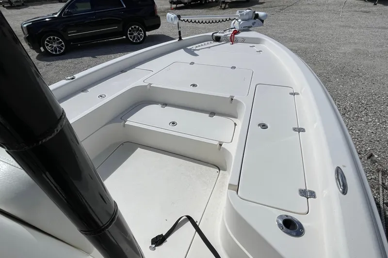 Slide: The Image of 2014 ShearWater 23TE boat console with chrome controls and cup holders. - 20