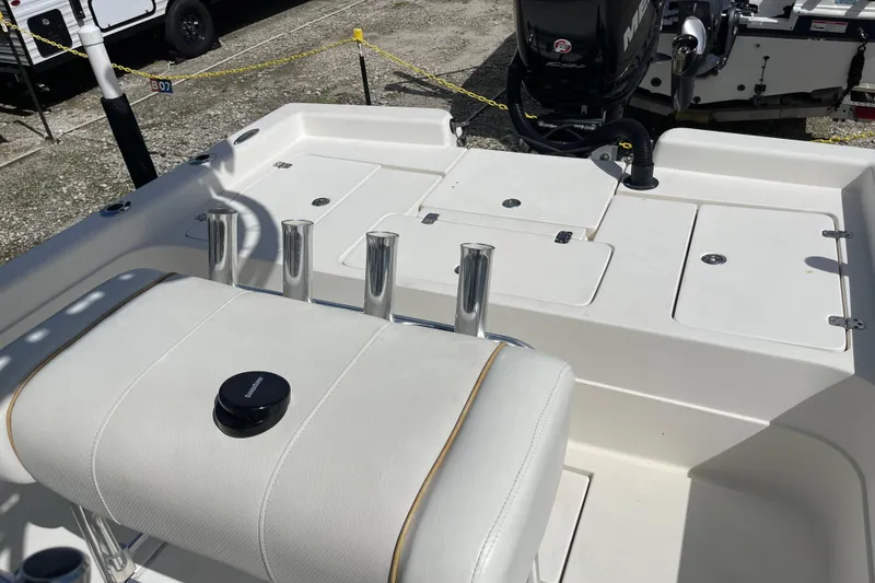 Slide: The Image of Open storage compartments on a 2014 ShearWater 23TE boat, showing interior details. - 28
