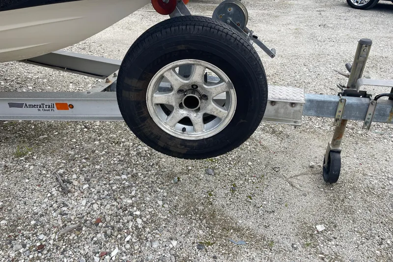 Slide: The Image of 2014 ShearWater 23TE boat interior with Yeti cooler and seating. - 32