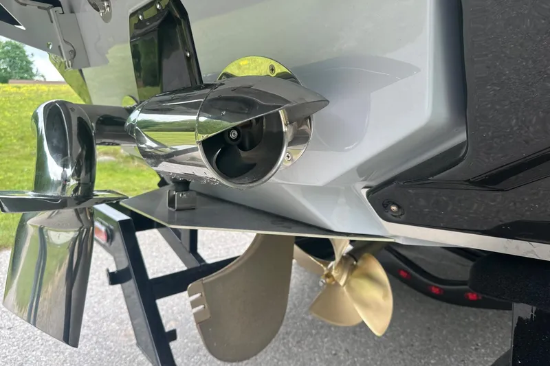 Slide: The Image of 2025 Nautique Super Air Nautique G23 boat propeller and exhaust detail. - 15