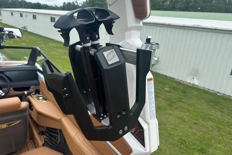 Slide: The Image of 2025 Nautique Super Air Nautique G23 boat interior with advanced wakeboard rack. - 22