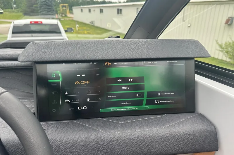 Slide: The Image of 2025 Nautique Super Air Nautique G23 dashboard display with control interface. - 26