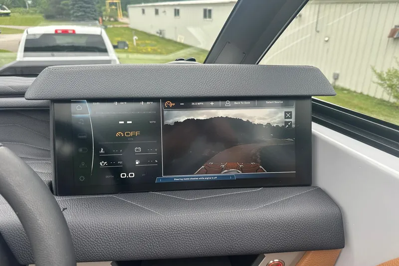 Slide: The Image of 2025 Nautique Super Air Nautique G23 dashboard with digital display and rearview camera. - 36