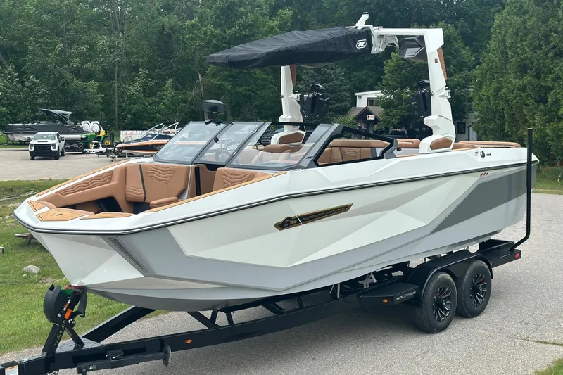 Slide: The Image of 2025 Nautique Super Air Nautique G23 boat on trailer, parked outdoors. - 37
