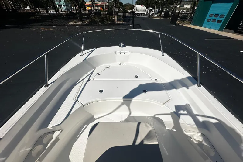 Slide: The Image of 2022 Boston Whaler 170 Montauk boat deck with railings and storage compartments. - 5