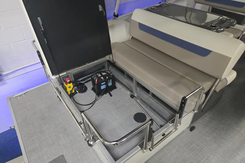 Slide: The Image of 2025 Princecraft Vectra 23 RL boat interior with open storage compartment and battery. - 10