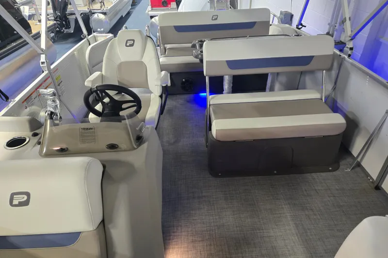 Slide: The Image of 2025 Princecraft Vectra 23 RL pontoon boat interior with seating and steering console. - 12