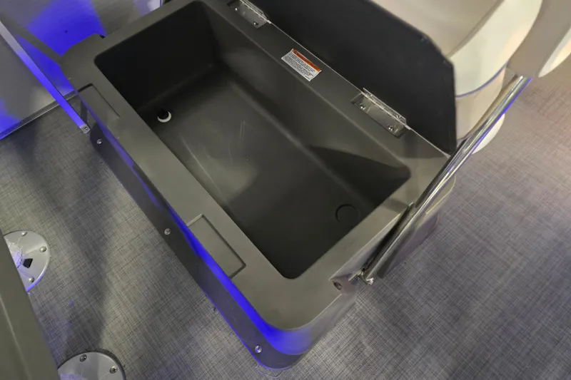 Slide: The Image of Open storage compartment in 2025 Princecraft Vectra 23 RL boat, featuring sleek design and blue lighting. - 14