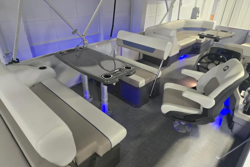 Slide: The Image of 2025 Princecraft Vectra 23 RL pontoon boat interior with seating and table setup. - 6