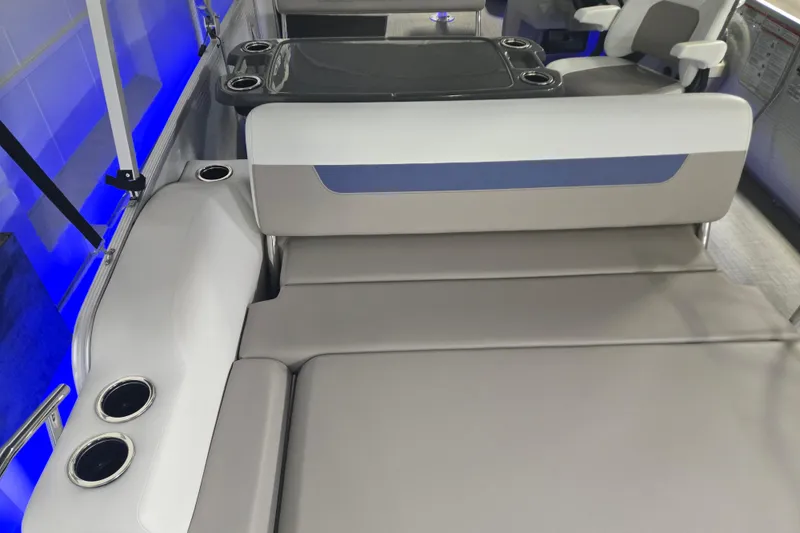 Slide: The Image of 2025 Princecraft Vectra 23 RL boat interior with seating and cup holders, featuring blue LED lighting. - 7