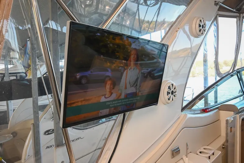 Slide: The Image of 2001 Cruisers Yachts 3672 Express interior with mounted TV and speakers. - 19