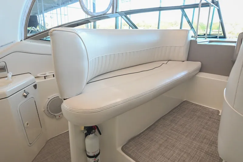 Slide: The Image of 2001 Cruisers Yachts 3672 Express interior with white seating and modern design. - 22