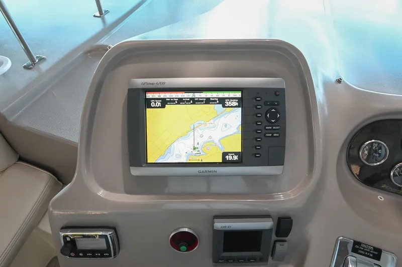 Slide: The Image of Garmin GPS system on 2001 Cruisers Yachts 3672 Express dashboard. - 27