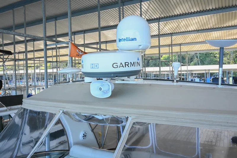 Slide: The Image of 2001 Cruisers Yachts 3672 Express with Garmin and Intellian equipment in marina. - 38