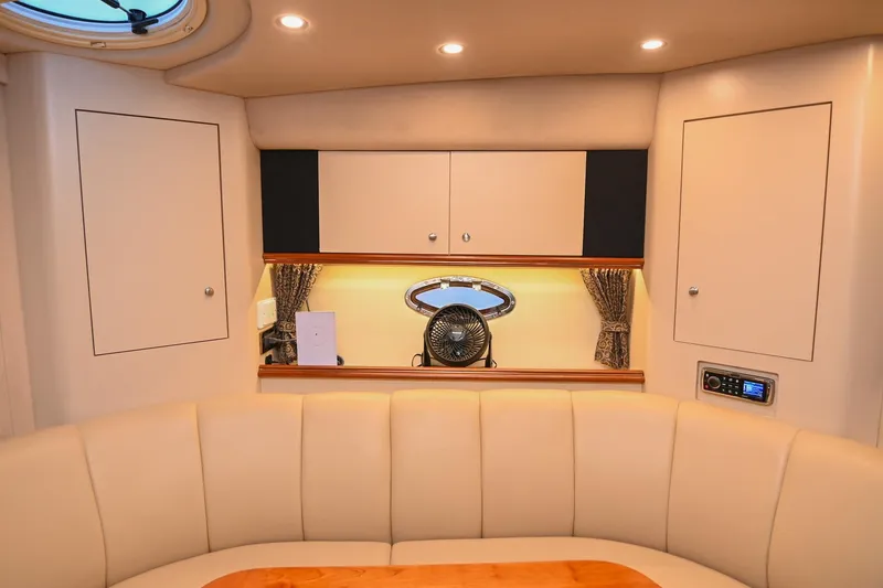 Slide: The Image of Luxurious interior of 2001 Cruisers Yachts 3672 Express with elegant seating and cabinetry. - 51