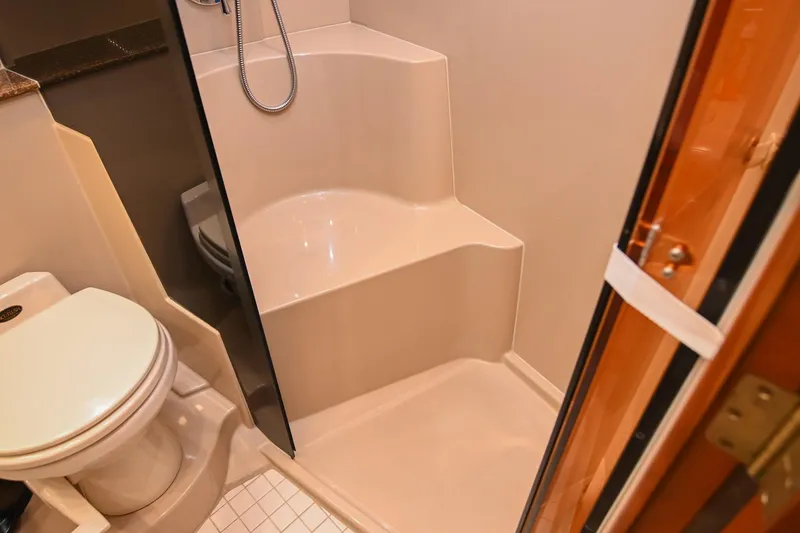 Slide: The Image of Bathroom interior of 2001 Cruisers Yachts 3672 Express with shower and toilet. - 58