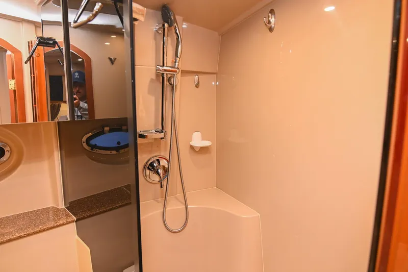 Slide: The Image of Luxurious bathroom in 2001 Cruisers Yachts 3672 Express with modern shower fixtures. - 59