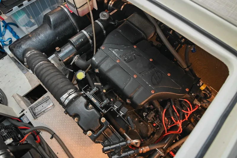 Slide: The Image of Engine compartment of 2001 Cruisers Yachts 3672 Express, showcasing detailed mechanical components. - 67