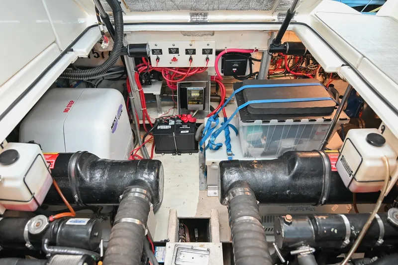 Slide: The Image of Engine room of 2001 Cruisers Yachts 3672 Express with batteries and wiring. - 69