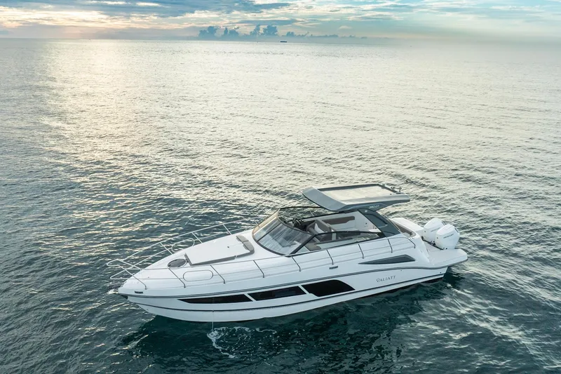 Slide: The Image of Valiatt 380GT 2025 luxury yacht cruising on serene ocean waters at sunset. - 2