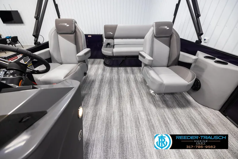 Slide: The Image of Interior of 2025 Bennington 21 SSB boat with modern seating and steering console. - 14