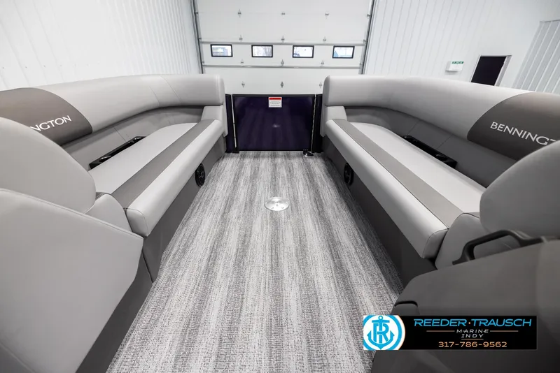 Slide: The Image of Interior of 2025 Bennington 21 SSB pontoon boat with gray seating and flooring. - 18