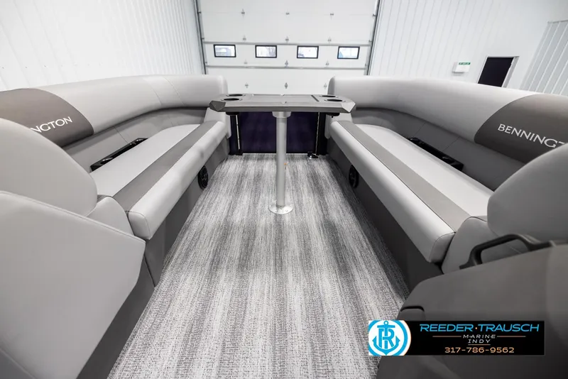Slide: The Image of Luxurious interior of 2025 Bennington 21 SSB pontoon boat with plush seating and table. - 19
