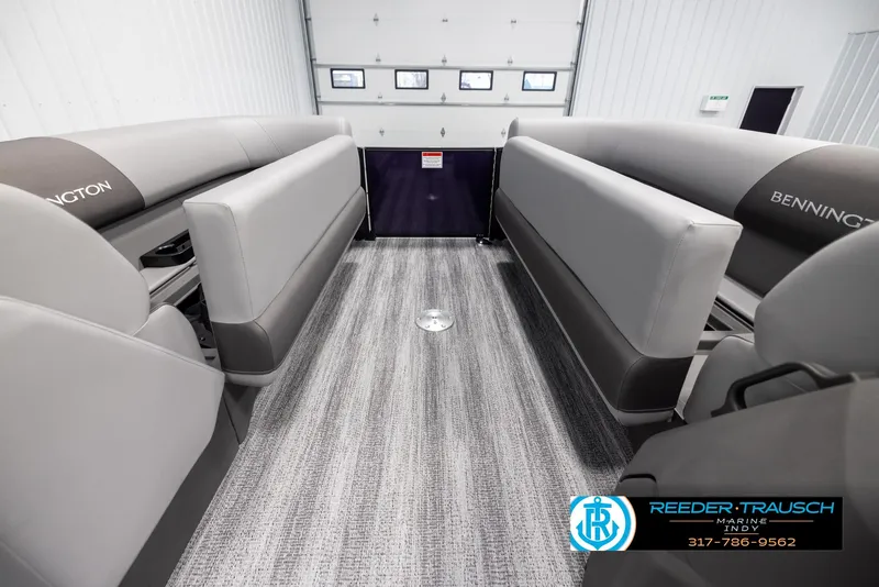 Slide: The Image of 2025 Bennington 21 SSB interior with gray seating and carpeted flooring. - 20