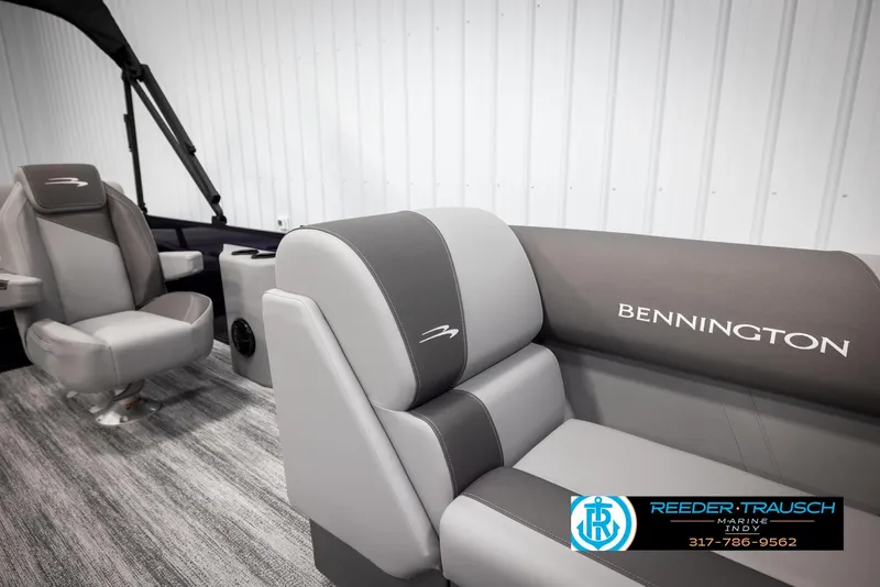 Slide: The Image of 2025 Bennington 21 SSB boat interior with gray seating and logo. - 21