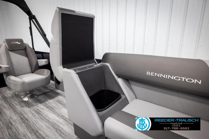 Slide: The Image of 2025 Bennington 21 SSB boat interior with storage compartment and seating. - 22