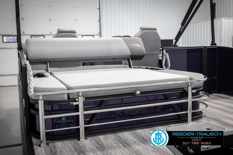 Slide: The Image of 2025 Bennington 21 SSB pontoon boat interior with plush seating and modern design. - 26
