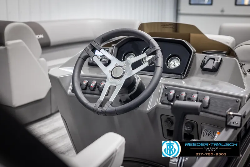 Slide: The Image of 2025 Bennington 21 SSB boat dashboard with steering wheel and control panel. - 27