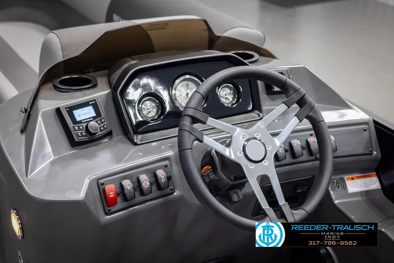 Slide: The Image of 2025 Bennington 21 SSB boat dashboard with steering wheel and control panel. - 28