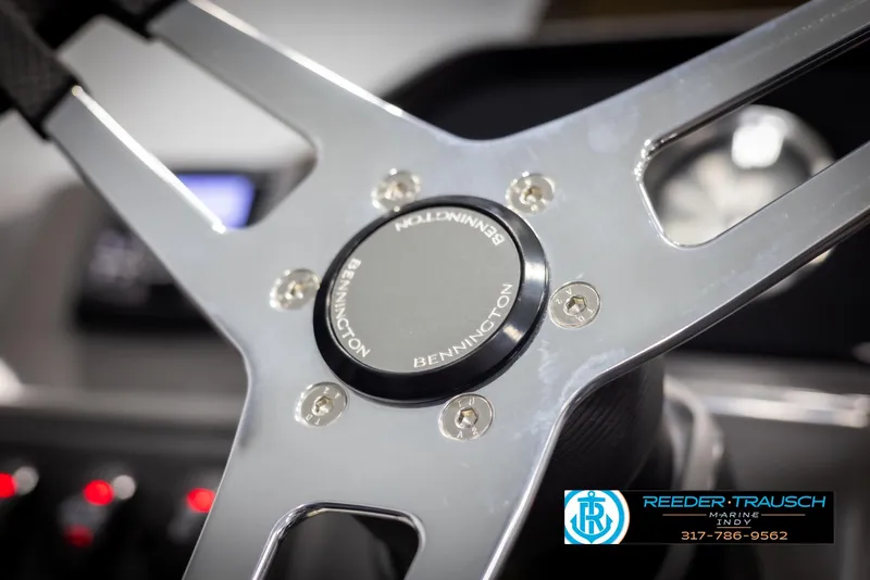 Slide: The Image of Steering wheel of 2025 Bennington 21 SSB boat, featuring sleek metallic design. - 29