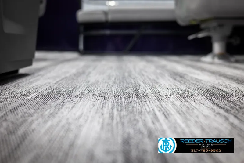 Slide: The Image of 2025 Bennington 21 SSB boat interior flooring, textured design, Reeder Trausch Marine logo. - 44