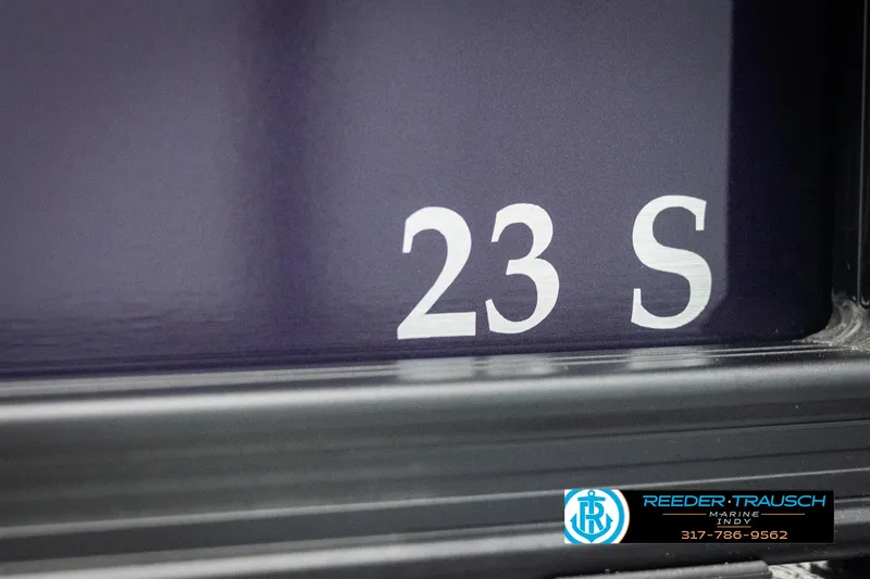 Slide: The Image of Close-up of 2025 Bennington 21 SSB boat model number '23 S' with dealership logo. - 46