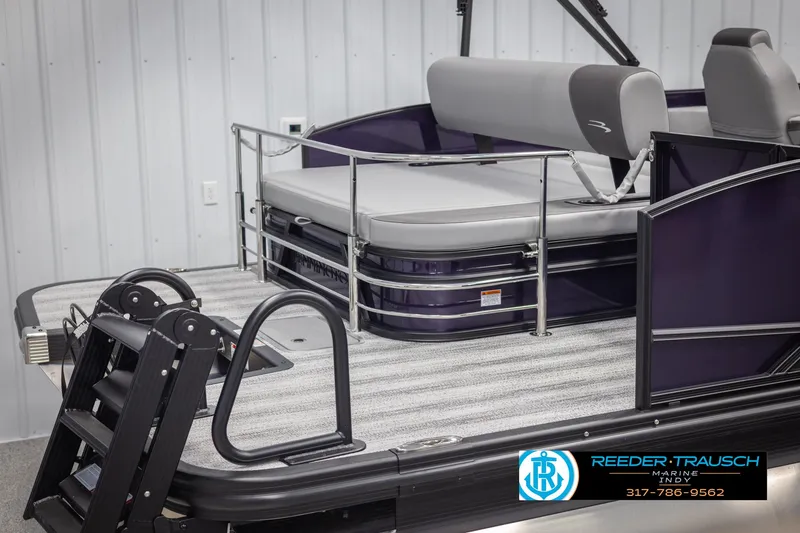 Slide: The Image of 2025 Bennington 21 SSB pontoon boat with gray seating and safety railing. - 49
