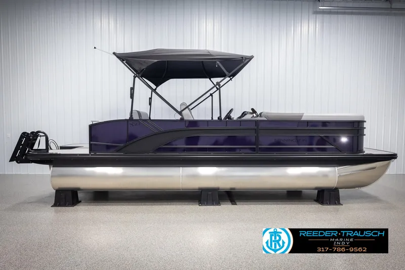 Slide: The Image of 2025 Bennington 21 SSB pontoon boat with canopy in showroom. - 5