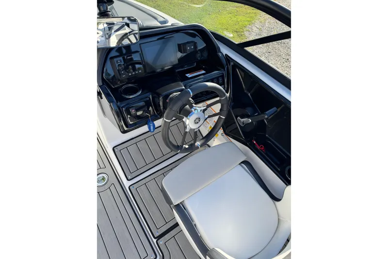 Slide: The Image of 2024 Yamaha Boats 195S cockpit with steering wheel and control panel. - 5