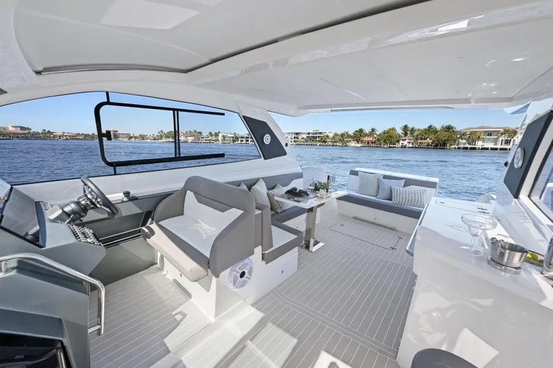 Slide: The Image of Luxurious 2025 VALIATT YACHTS 380 Bowrider interior with elegant seating and scenic water view. - 10
