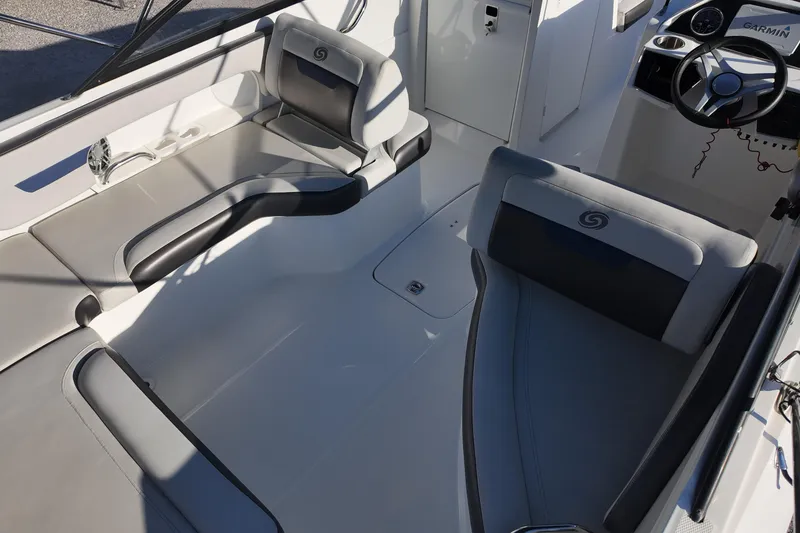 Slide: The Image of 2022 Hurricane SunDeck 235 OB boat interior with sleek seating and modern dashboard. - 13