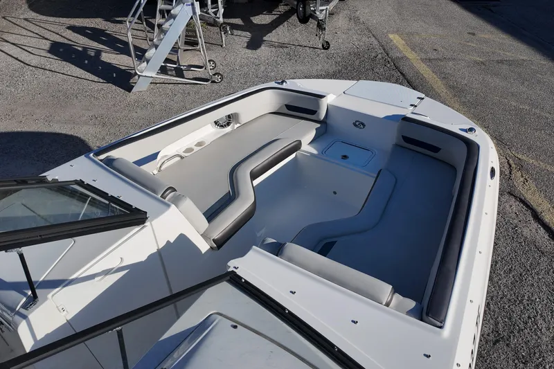 Slide: The Image of 2022 Hurricane SunDeck 235 OB boat interior with spacious seating and modern design. - 15