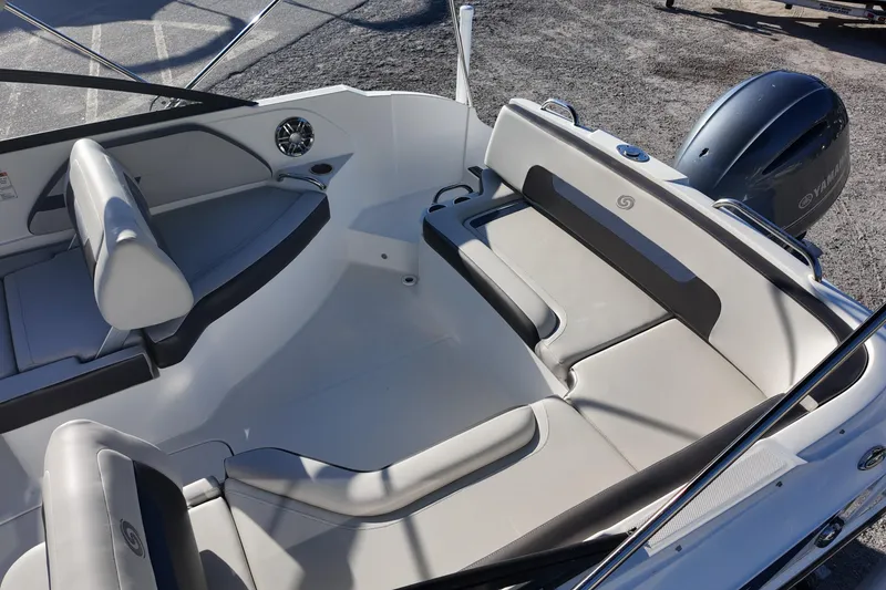 Slide: The Image of 2022 Hurricane SunDeck 235 OB boat interior with spacious seating and modern design. - 19